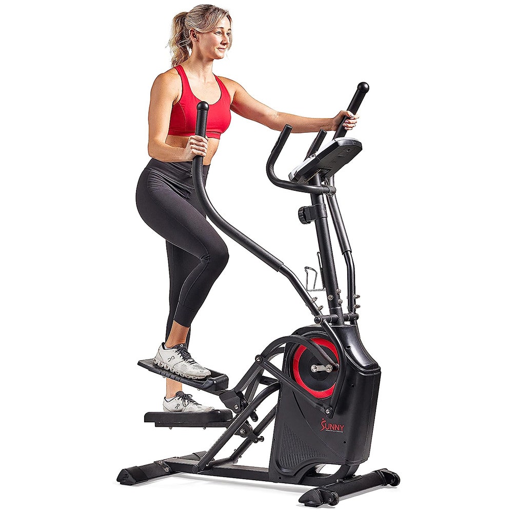 Woman using stepping machine