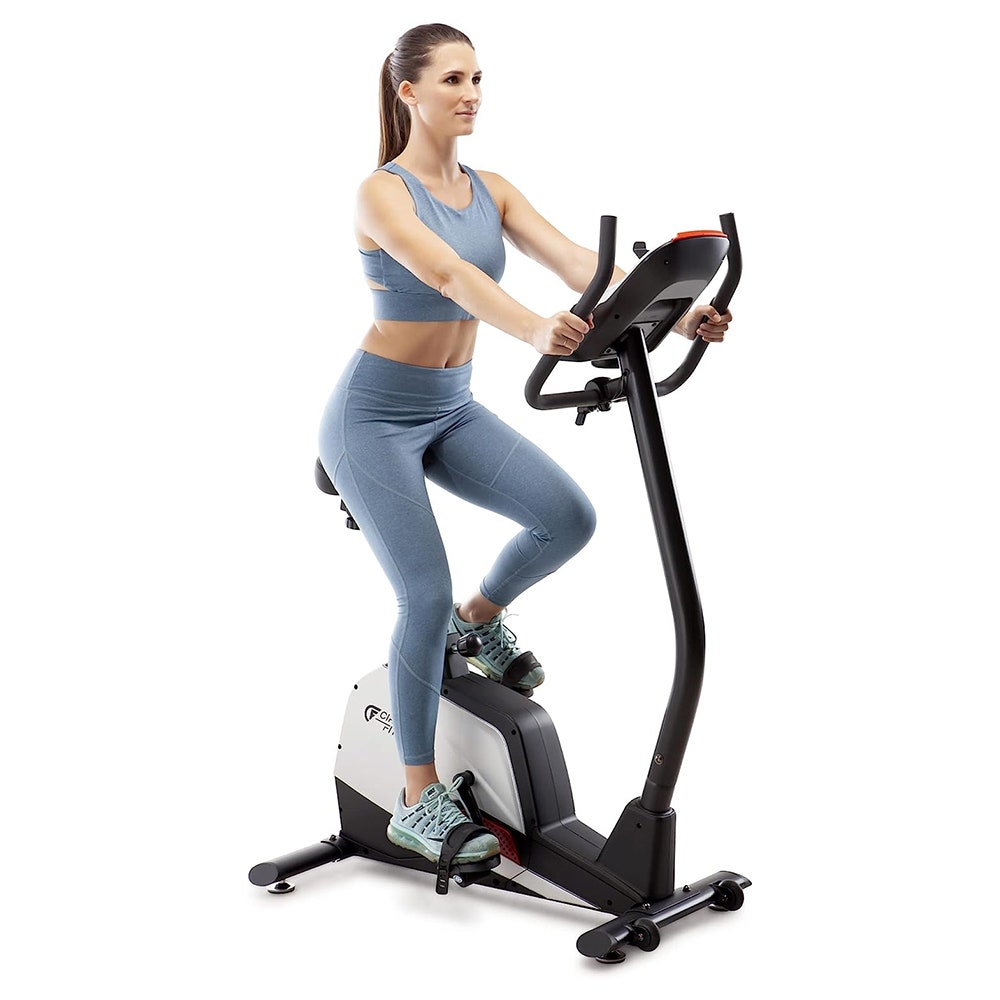 Woman using an upright bike machine
