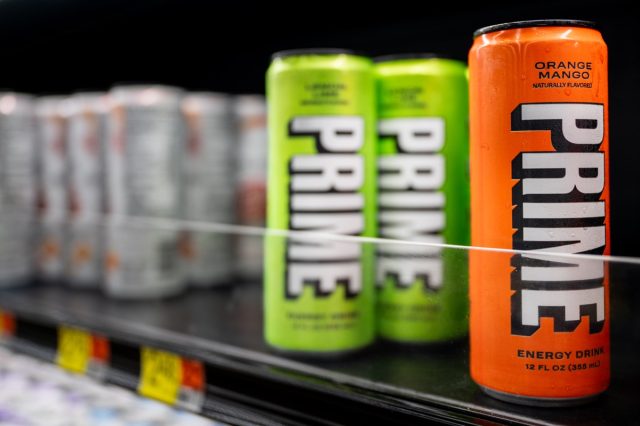 PRIME energy drinks are displayed for sale on the shelves of a Walmart Supercenter